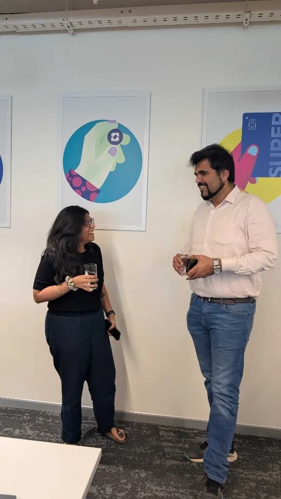 Team members talking in the office